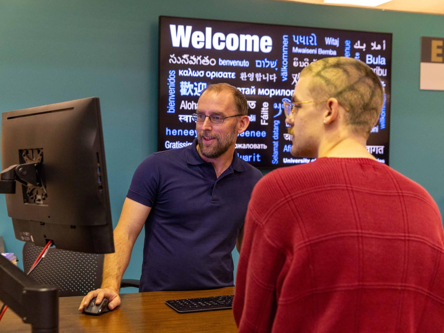 A student gets help at the Ask a Librarian desk.
