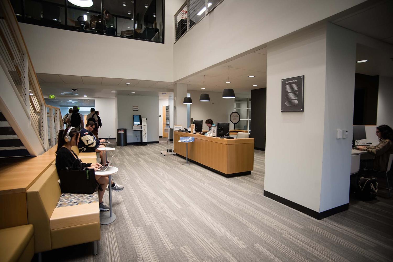 The front desk and study area of the Business Library