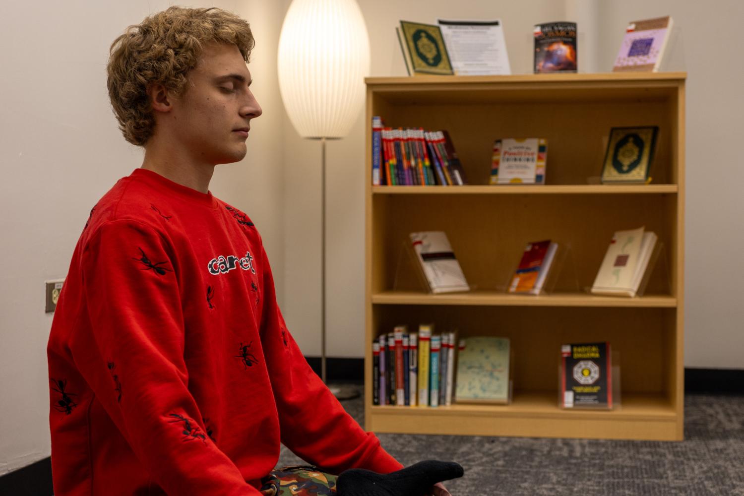 A student meditates in the Mindfulness Room