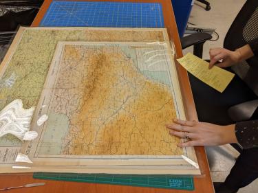 The maps are placed in sleeves.